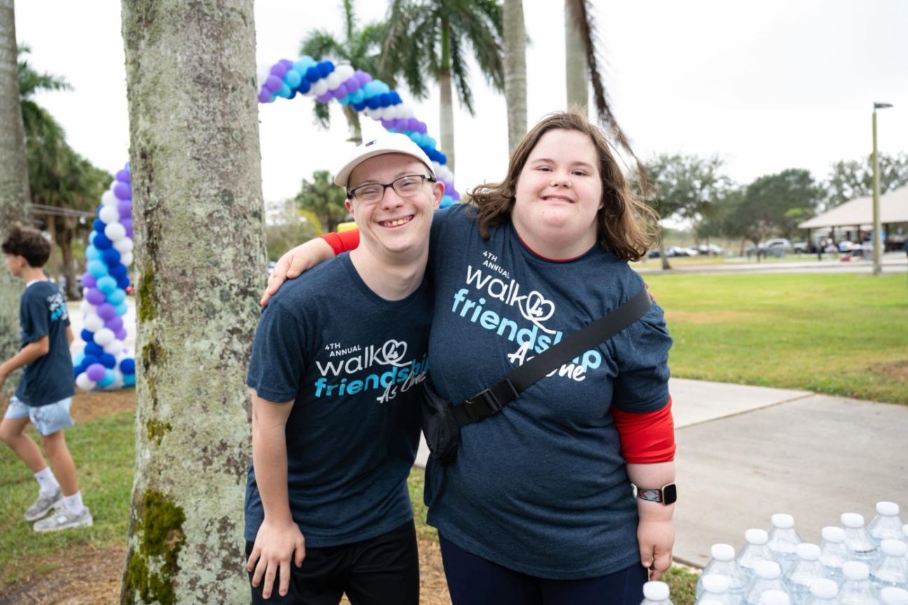 Two friends in Walk4Friendship shirts at the 2026 walk